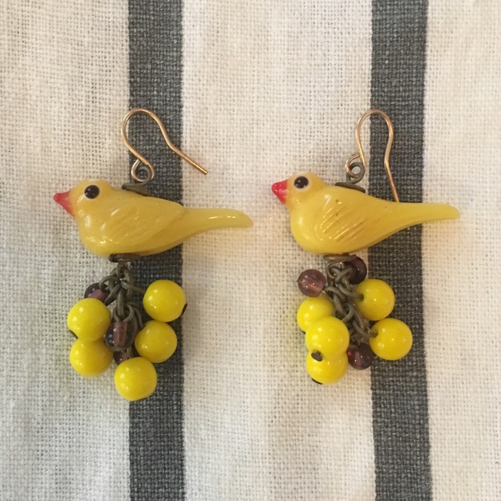 Handmade yellow glass bird earrings.